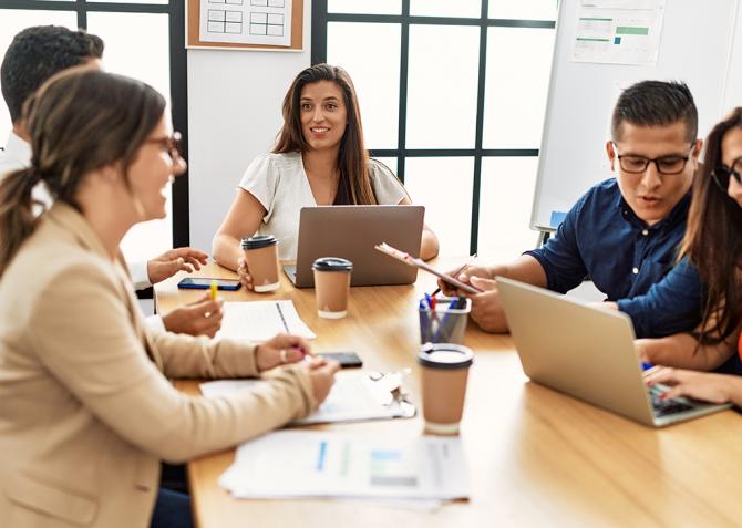 A group of business professionals in a meeting.