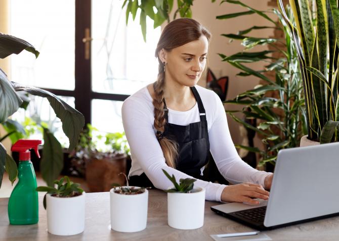 A person typing on a laptop.