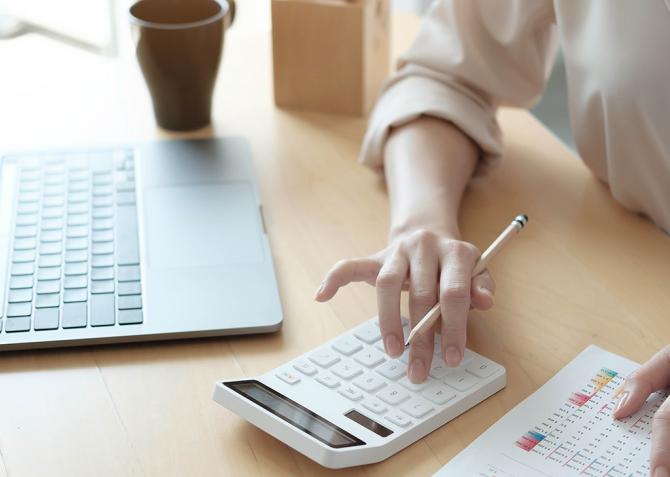 A person using a calculator.