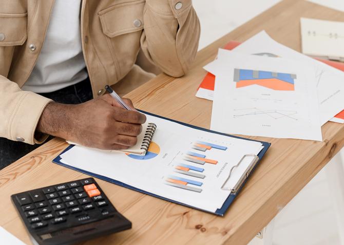 A person looking at a graph.