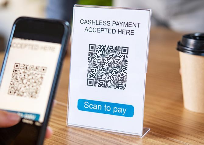 A person uses a QR code.