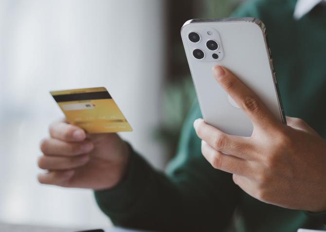 woman with credit card and iphone 