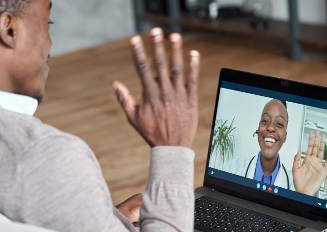 man talks to doctor on telehealth video