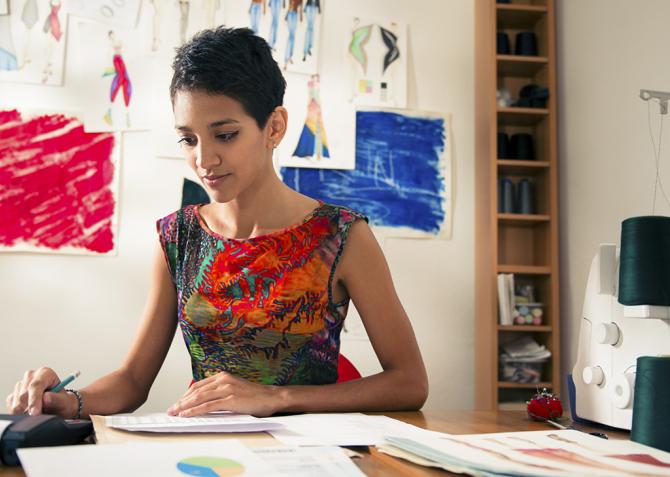 An entrepreneur goes over financing options while sitting at a table.