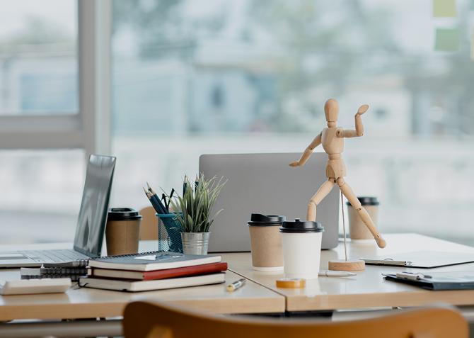 An image showing no one at their desk in an office setting.
